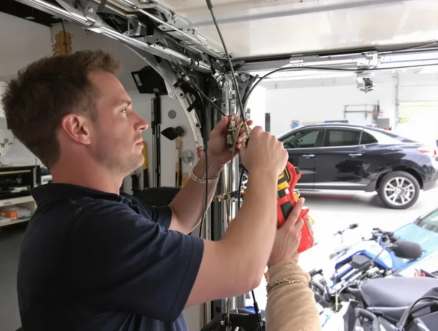 Douglasville Garage Door Repair safety certified technician performing cable replacement in Douglasville