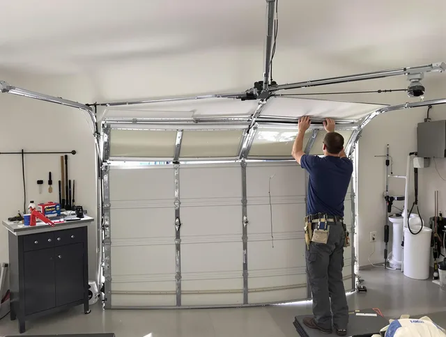 Douglasville Garage Door Repair specialist performing precise section replacement on Douglasville garage door